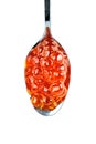 Red caviar in the silver spoon. Isolated object on white background. Close up. Top view. Royalty Free Stock Photo