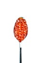 Red caviar in the silver spoon. Isolated object on white background. Close up. Top view. Royalty Free Stock Photo