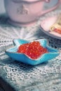 Red caviar in small starfish shaped bowl Royalty Free Stock Photo