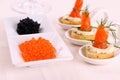 Red caviar and smoked salmon rolls Royalty Free Stock Photo