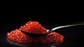 Red Caviar in a spoon. Caviar in bowl over black background. Texture of caviar. Seafood isolated on black, generative ai Royalty Free Stock Photo