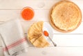 Red caviar in the spoon and pancakes in plate Royalty Free Stock Photo