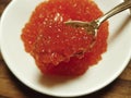 Red caviar spoon plate delicatessen Royalty Free Stock Photo