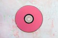 CD or DVD disc on pink background Royalty Free Stock Photo