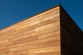 Red cedar siding wood facade architecture on blue sky background