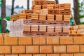 Red ceramic bricks at the construction site. Keramoblock. Hollow brick. Construction of a red brick building. Close-up. Material Royalty Free Stock Photo