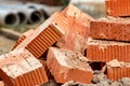 Red ceramic bricks at the construction site. Keramoblock. Hollow brick. Construction of a red brick building. Close-up. Material Royalty Free Stock Photo