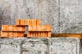 Red ceramic bricks at the construction site. Keramoblock. Hollow brick. Construction of a red brick building. Close-up. Material Royalty Free Stock Photo