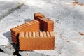 Red ceramic bricks at the construction site. Keramoblock. Hollow brick. Construction of a red brick building. Close-up. Material Royalty Free Stock Photo