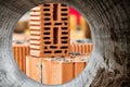 Red ceramic bricks at the construction site. Keramoblock. Hollow brick. Construction of a red brick building. Close-up. Material Royalty Free Stock Photo