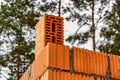 Red ceramic bricks at the construction site. Keramoblock. Hollow brick. Construction of a red brick building. Close-up. Material Royalty Free Stock Photo