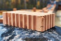 Red ceramic bricks at the construction site. Keramoblock. Hollow brick. Construction of a red brick building. Close-up. Material Royalty Free Stock Photo