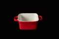 Red ceramic mold baking dish. Isolated on black background Royalty Free Stock Photo