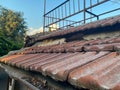 Red ceramic tiles on the roof of the house vintage natural ancient old beautiful, close view. Natural classical building materials Royalty Free Stock Photo