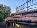 Red ceramic tiles on the roof of the house vintage natural ancient old beautiful, close view. Natural classical building materials Royalty Free Stock Photo