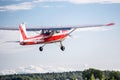 Red Cessna 150 takes off from the runway Royalty Free Stock Photo