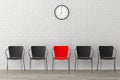 Red Chair with Another Black against wall with Modern Clock Royalty Free Stock Photo
