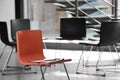 Red chair with clipboard in office prepared for group therapy. Meeting room Royalty Free Stock Photo