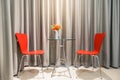 Red chair in living room with drapery Royalty Free Stock Photo