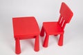 Red chair and red table for children in kindergarten preschool classroom Royalty Free Stock Photo