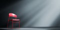 Red chair in spotlight. Concept of interview, interrogation or consulation Royalty Free Stock Photo