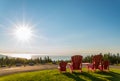 Red chairs from Butland lookoff with a beautiful view of Fundy