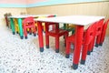 Red chairs and small tables in the nursery class Royalty Free Stock Photo
