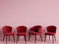 Red chairs are standing in an empty pink room. Royalty Free Stock Photo