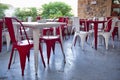 Red chairs and white tables in caffe