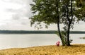 Red chear on lake beach