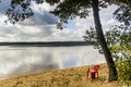 Red chear on lake beach