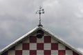 Red-checkered Barn with Weather Vane