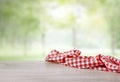 Red checkered cloth on wooden table empty space. Picnic towel natural background food display Royalty Free Stock Photo