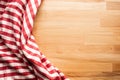 Red checkered fabric on wood table background.For decoration key visual