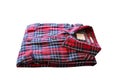 Red checkered flannel shirt folded on a white isolated background Royalty Free Stock Photo
