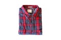 Red checkered flannel shirt folded on a white isolated background Royalty Free Stock Photo