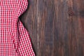 Red checkered napkin on a rustic wooden table with copy space for placing your text or product Royalty Free Stock Photo