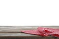 Red checkered napkins on wooden table against white background Royalty Free Stock Photo