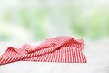 Red checkered picnic cloth on wooden table natural blurred background,product display Royalty Free Stock Photo