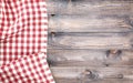 Red checkered tablecloth on light wooden table with, top view with copy space Royalty Free Stock Photo