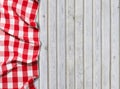 Red checkered tablecloth on white wooden background Royalty Free Stock Photo