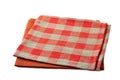 Red and red-checkered textile napkins stacked on white background Royalty Free Stock Photo