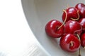 Red cheery in white dish