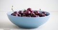 Red cherries in antique bowl