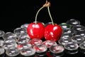 Red cherries and glass beads Royalty Free Stock Photo