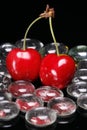 Red Cherries with Glass Beads Royalty Free Stock Photo