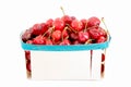 Red cherries in wooden basket on white background Royalty Free Stock Photo
