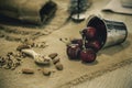 red cherry and ground almonds for sprinkling sweet food in a wooden spoons and dried almond seeds on the hemp sack Royalty Free Stock Photo