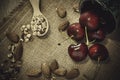 red cherry and ground almonds for sprinkling sweet food in a wooden spoons Royalty Free Stock Photo