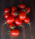 Red cherry tomatoes on a wooden backgound Royalty Free Stock Photo